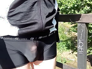 Translucent cyclodress bike ride in public. Cycling in extreme weather.